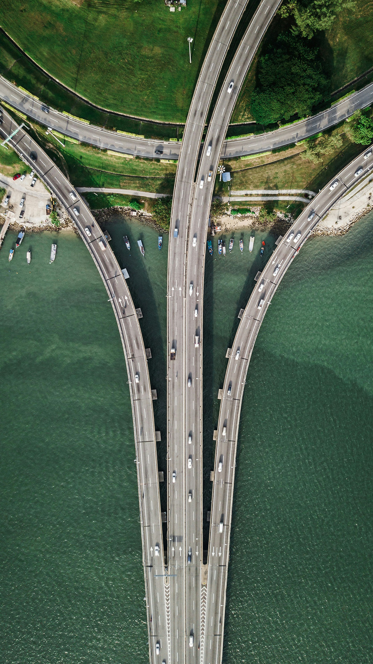 A road bridge crossing an estuary, seen from above